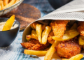 Closeup of Fish & Chips served in the newspaper