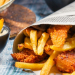 Closeup of Fish & Chips served in the newspaper