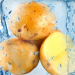 Ice cube and potato isolated on a white background