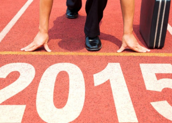 happy new year 2015. businessman preparing for running with briefcase