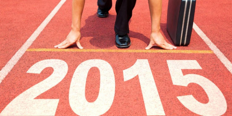 happy new year 2015. businessman preparing for running with briefcase