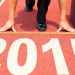 happy new year 2015. businessman preparing for running with briefcase