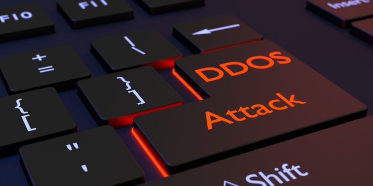 Black computer keyboard with the words DDOS attack on the enter key distributed denial of service concept 3D illustration