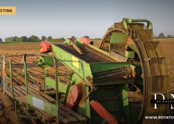 Potato harvester on a harvested field in Germany