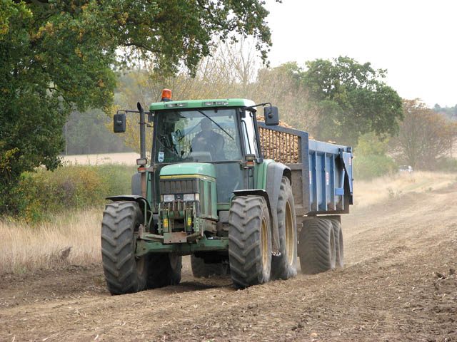 Harvester leaving a potato field to offload